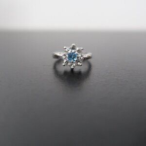 Woman's Silver Tone Ring Light Blue Stone with White Stones Size 5.75
